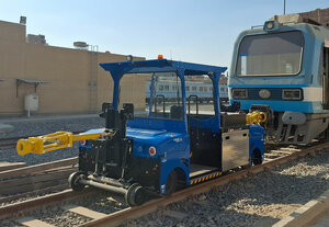 Electric shunting vehicle with driver's cab in front of a carriage in Egypt